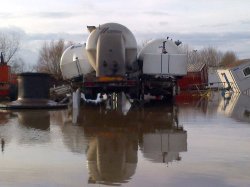 Photos of the aftermath of the flood. Such was the force of the incoming water that walls were destroyed and cement silo trucks left the ground.