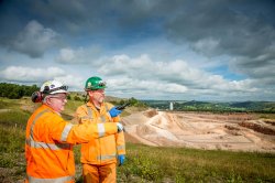 Experts from the plant survey part of the limestone quarry, with the plant’s preheater tower seen in the far background.