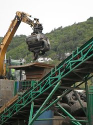 Locally-sourced car and truck tyres are cut twice using the same shredder into relatively small pieces by RagnSells, an external contractor. The cut tyres are taken by tipper truck to the fuel loading area.