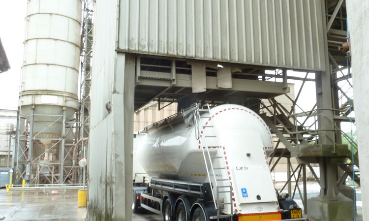 Cement leaving in a bulk tanker.